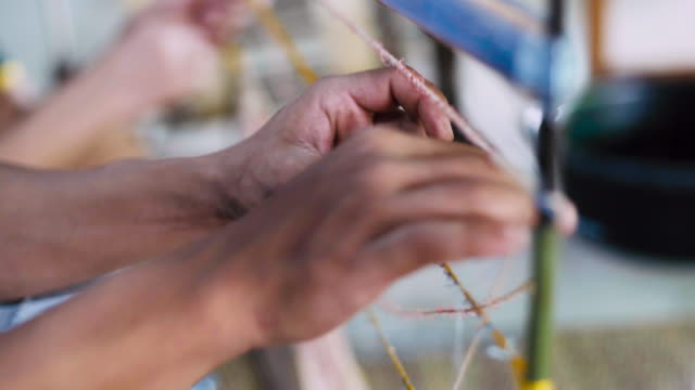 Asian Workers Making Ties Mudmee Board Weaving or Ikat Thai Silk Pattern Weaving Before Bring to Tie and Dyed.