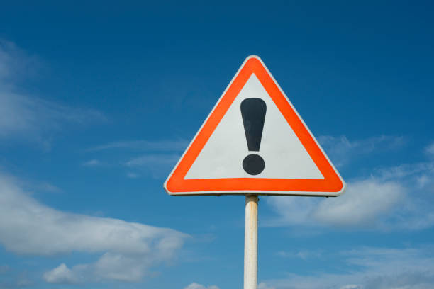 istock Exclamation point of attention on a yellow triangular sign with a sign for signing. 1159053468