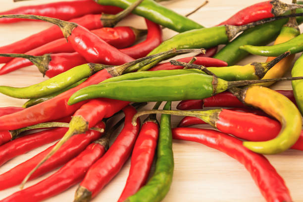 istock red green chile pepper spicy thin pod close-up vegetable background 1159054490
