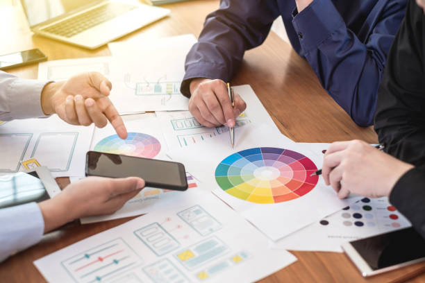 istock Designer website applications consulting and planning work together. Job training to colleagues. 1159056032