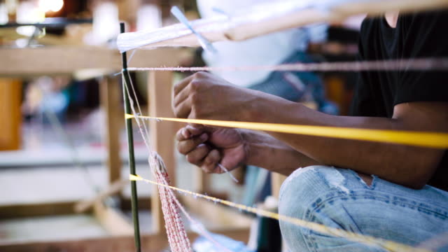 Asian Workers Making Ties Mudmee Board Weaving or Ikat Thai Silk Pattern Weaving Before Bring to Tie and Dyed.