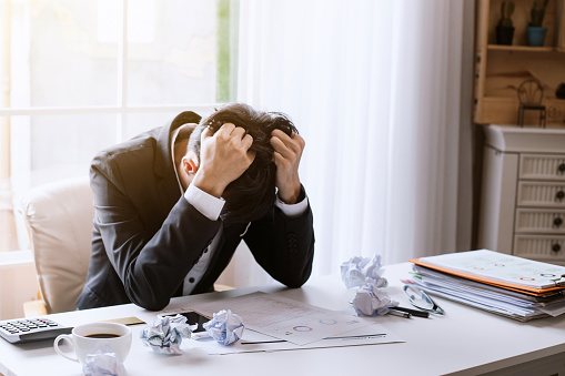 Businessman strain from work and business stresses fail.