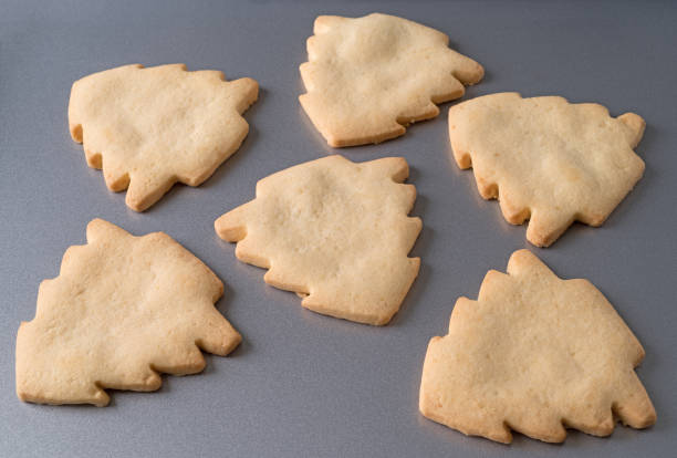 istock Tree shaped Christmas cookies on a baking sheet. 1159056336