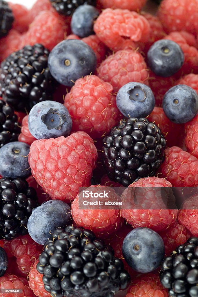 Mixed berry fruits, vertical Backgrounds Stock Photo