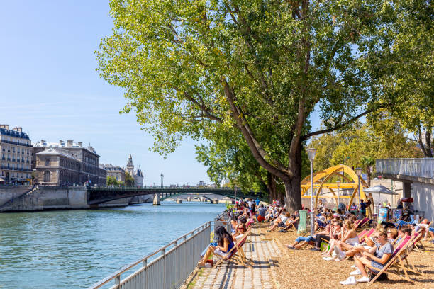 Paris, France - September 2, 2018: people from Paris enjoying a hot summer day at the Seine River margins