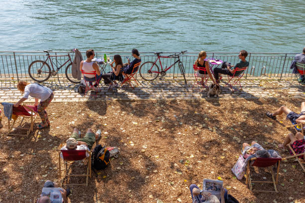 Paris, France - September 2, 2018: people from Paris enjoying a hot summer day at the Seine River margins