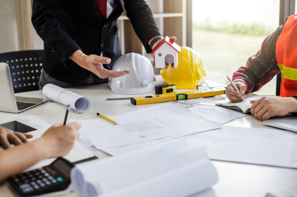 istock Teamwork process, Engineer and businessman meeting and planning construction project together. 1159058767
