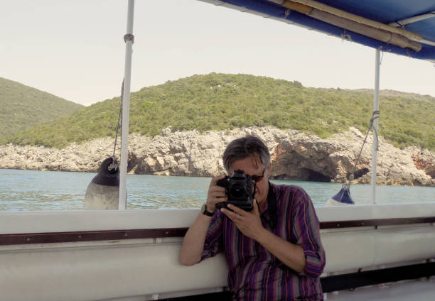 istock Man take a pictures from the ship deck 1159059972