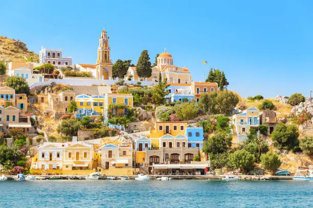 Scenic vivid seascape of a Greek island of Symi in the Dodecanese, Greece . Popular tourist attraction