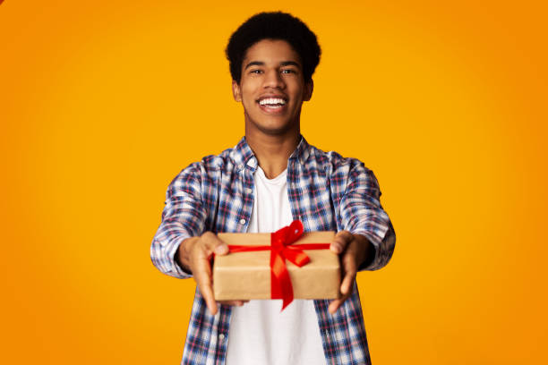 Happy Guy Offering Craft Gift Box to Camera