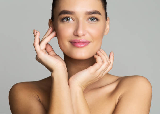 istock Natural Beauty. Millennial Woman Looking at Camera 1159063596