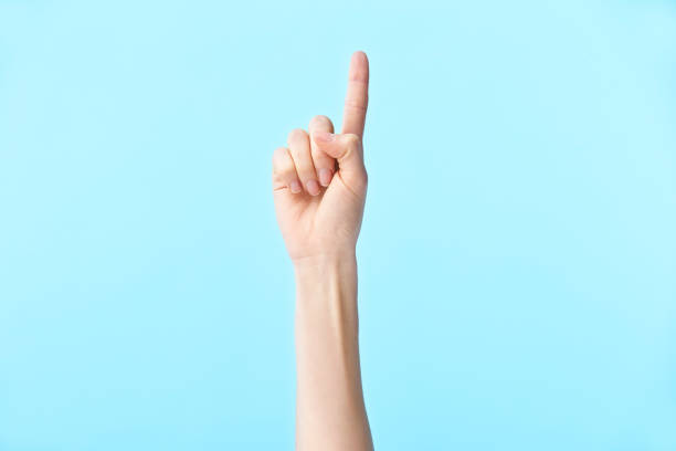 istock hand of female showing number one 1159069684