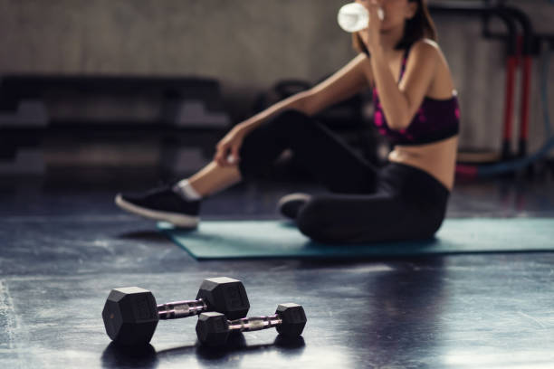 istock drink water after dumbbell muscle exercise 1159070042