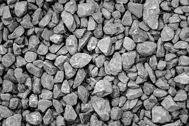 istock Close up of rounded grey river rocks 1159070150
