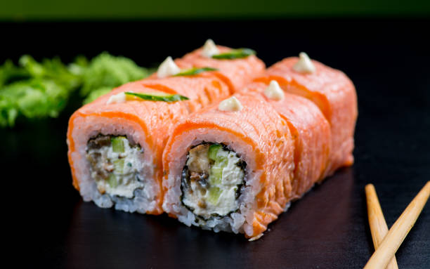 istock Japanese sushi and rolls on a black background 1159071254