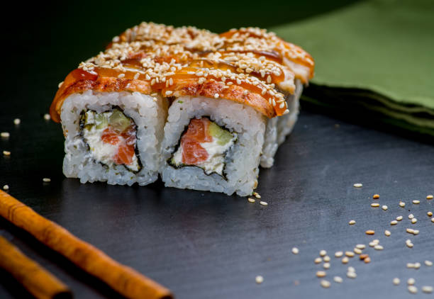 istock Japanese sushi and rolls on a black background 1159071275