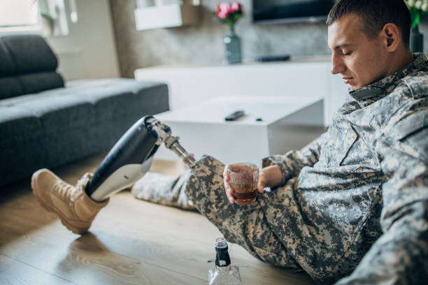 istock Depressed soldier drinking to forget 1159074176