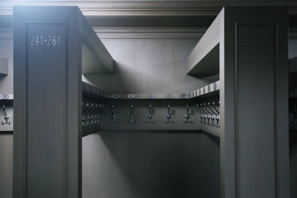 Metal hangers with numbers in cloakroom.