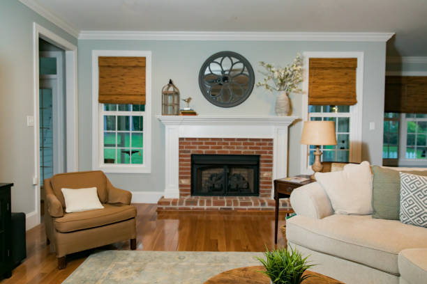 istock Empty traditional living room den with a fireplace 1159076456