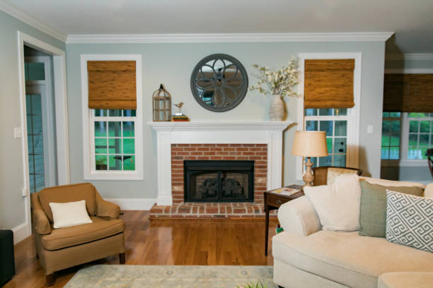 istock Empty traditional living room den with a fireplace 1159076462