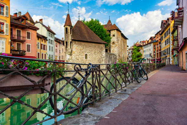 Streets of Annecy, France. Beautiful streets of famous ancient town with colorful buildings and parked bicycles near canal. stock photo