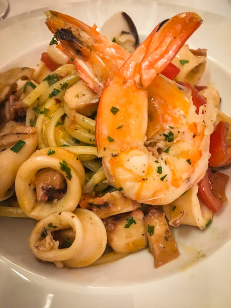 istock fresh italian pasta with mix seafood 1159080017