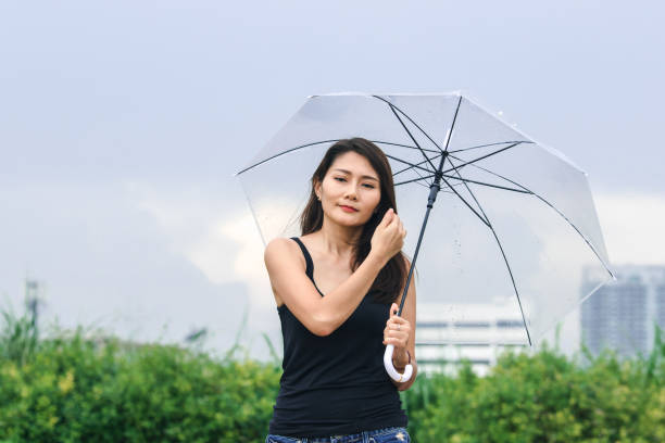 istock Women walking the umbrella 1159081042