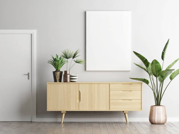 poster über sideboard im wohnzimmer mit pflanzen - anrichte stock-fotos und bilder