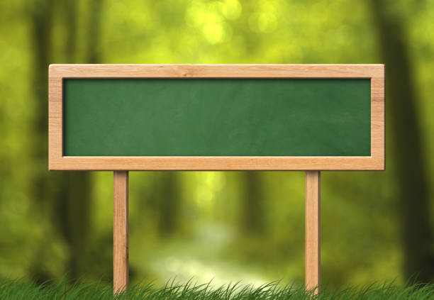 istock Oblong green blackboard sign forest background 1159082071