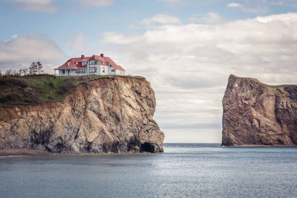 Little house on a cliff Gaspesie, Quebec, Canada - June 19, 2018: Historic house on a cliff next to Perce Rock in Canada. gulf of st lawrence photos stock pictures, royalty-free photos & images