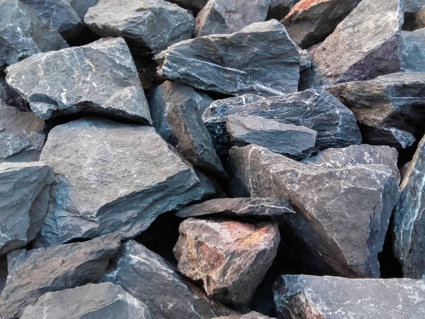 istock Gray  background of cracked stones . 1159083126