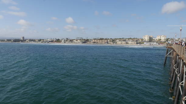 istock Oceanside Pier California with beach coastline shot in high resolution 1159087079