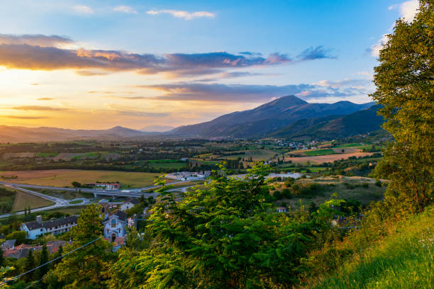 beautiful sunset in monte cucco, umbria, italy. view from fossato di vico - tuscan cypress foto e immagini stock