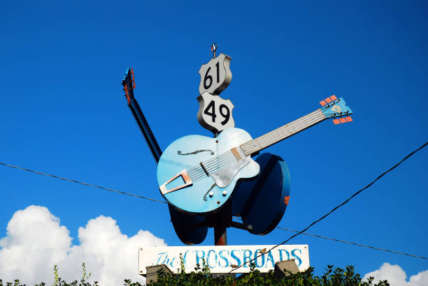 The Crossroads, made famous by a Blues Song, in Clarksdale, Mississippi Clarksdale, MS, USA July 20, 2010 The legendary Crossroads,the intersection of Routes 49 and 61 in Clarksdale, Mississippi, was made famous by blues and rock musicians. crossroads sign stock pictures, royalty-free photos & images