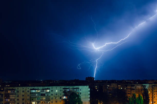 istock Thunderstorm with lightning and thunder over the night city 1159092563