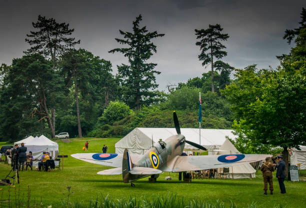 Spitfire plane and world war 2 RAF reenactment for Home Front fair in Hever Castle gardens Hever Castle had a ww2 Home Front fair on in their gardens with army equipment and people dressed in WW2 clothing for the day Hever Castle stock pictures, royalty-free photos & images