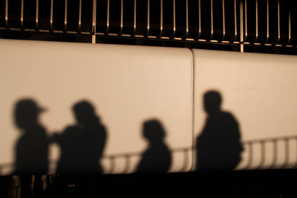 istock shadows of people walking down a ramp in the summer 1159093900