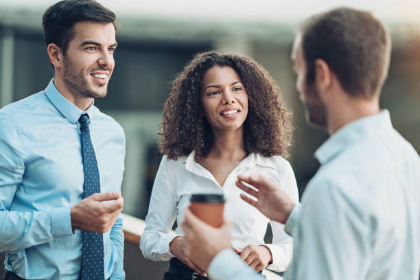 istock Group of business persons in friendly talk 1159095637