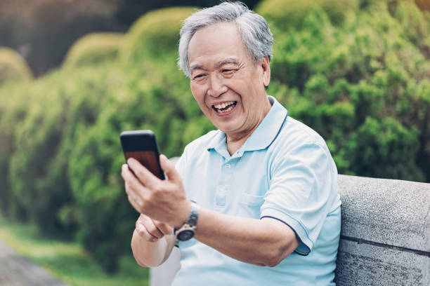 istock Happy senior man with cell phone 1159095639