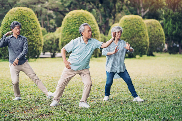 istock Group of seniors practicing tai chi 1159095642