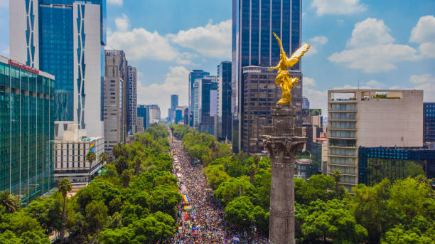 Reforma Avenue and Angel of Independence during the LGBTTTI Pride March stock photo