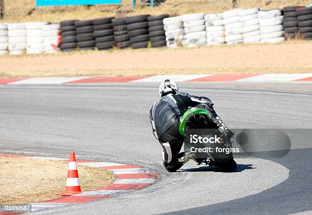 Rear View Of A Person On A Superbike Rounding A Sharp Curve Stock Photo - Download Image Now