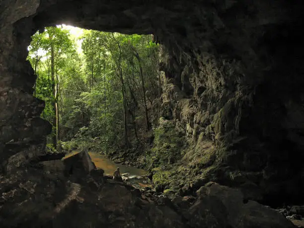 View looking through the cave at Barton Creek.  profile of man near bottom to give perspective; taken in Western Belize