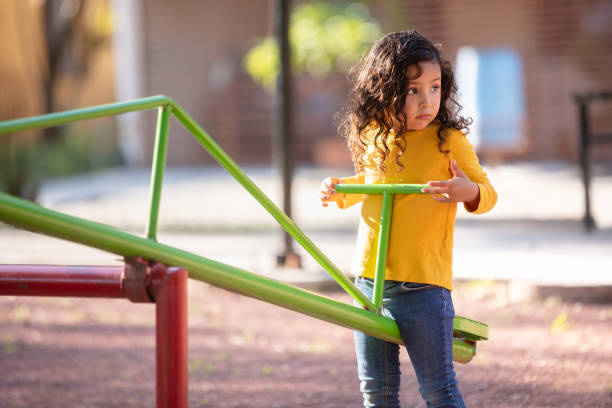 Father and girl playing in the park