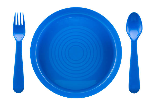 istock Set of blue plastic spoon, fork and plate isolated on white background 1159115288