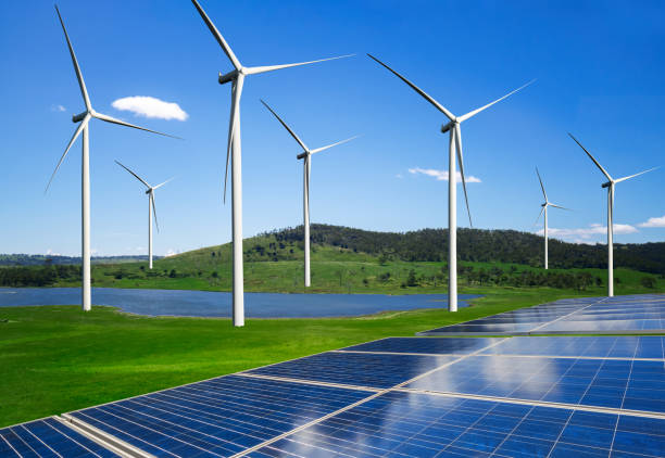 istock Solar panel and wind turbine farm clean energy. 1159119746