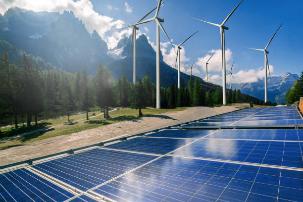 istock Solar panel and wind turbine farm clean energy. 1159119759