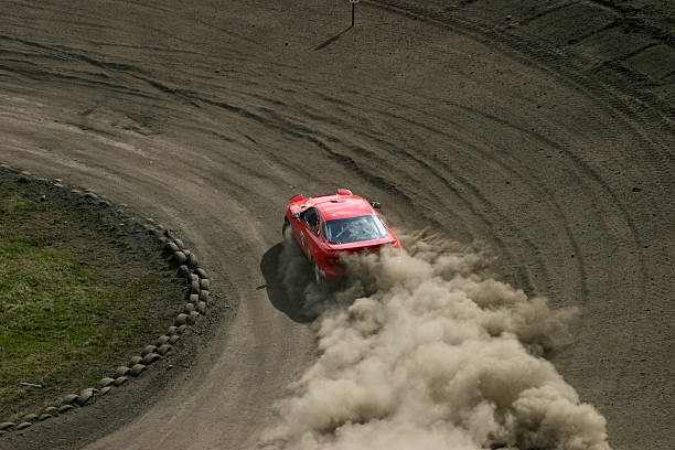 Red racing car Racing car driving on a racing track rally car racing stock pictures, royalty-free photos & images