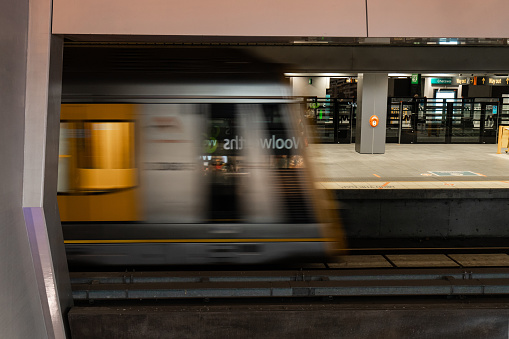 Sydney, Australia - May 27, 2019: Train in motion at Chatswood train station platform.