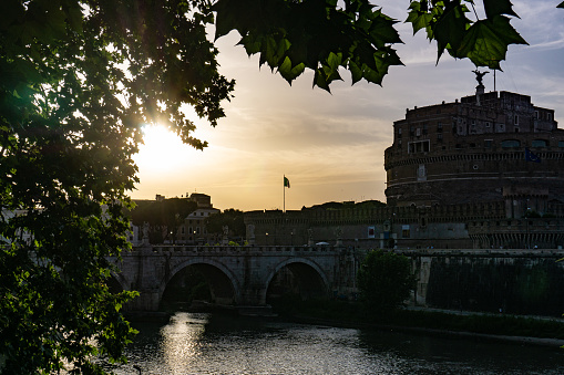 Rome, Italy - June, 2019: Sunset view on Tiber River (Tevere in Italian) near Castel Sant'Angelo across the Vatican City, Rome, Italy.